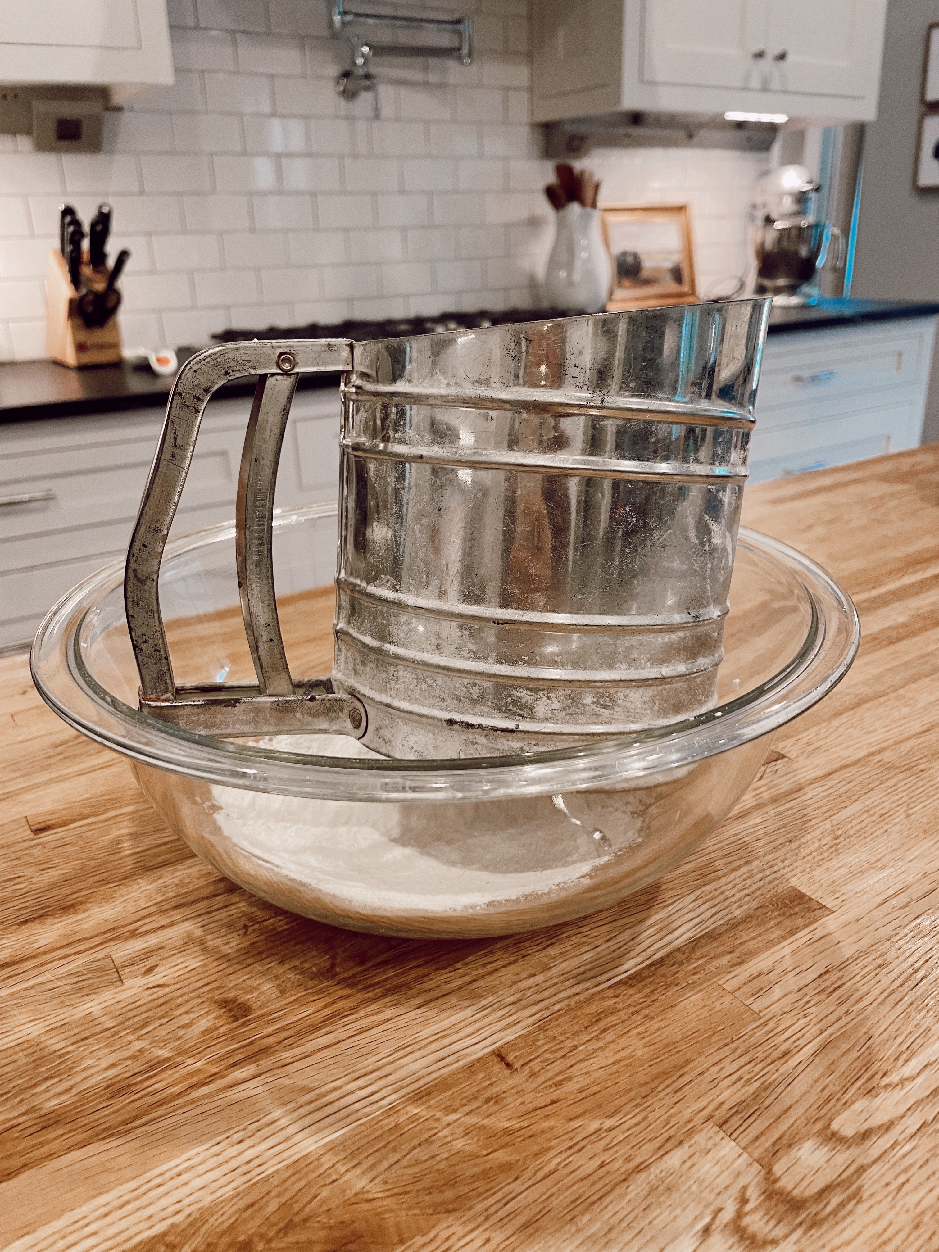 flour sifter in bowl with flour for making biscuits 