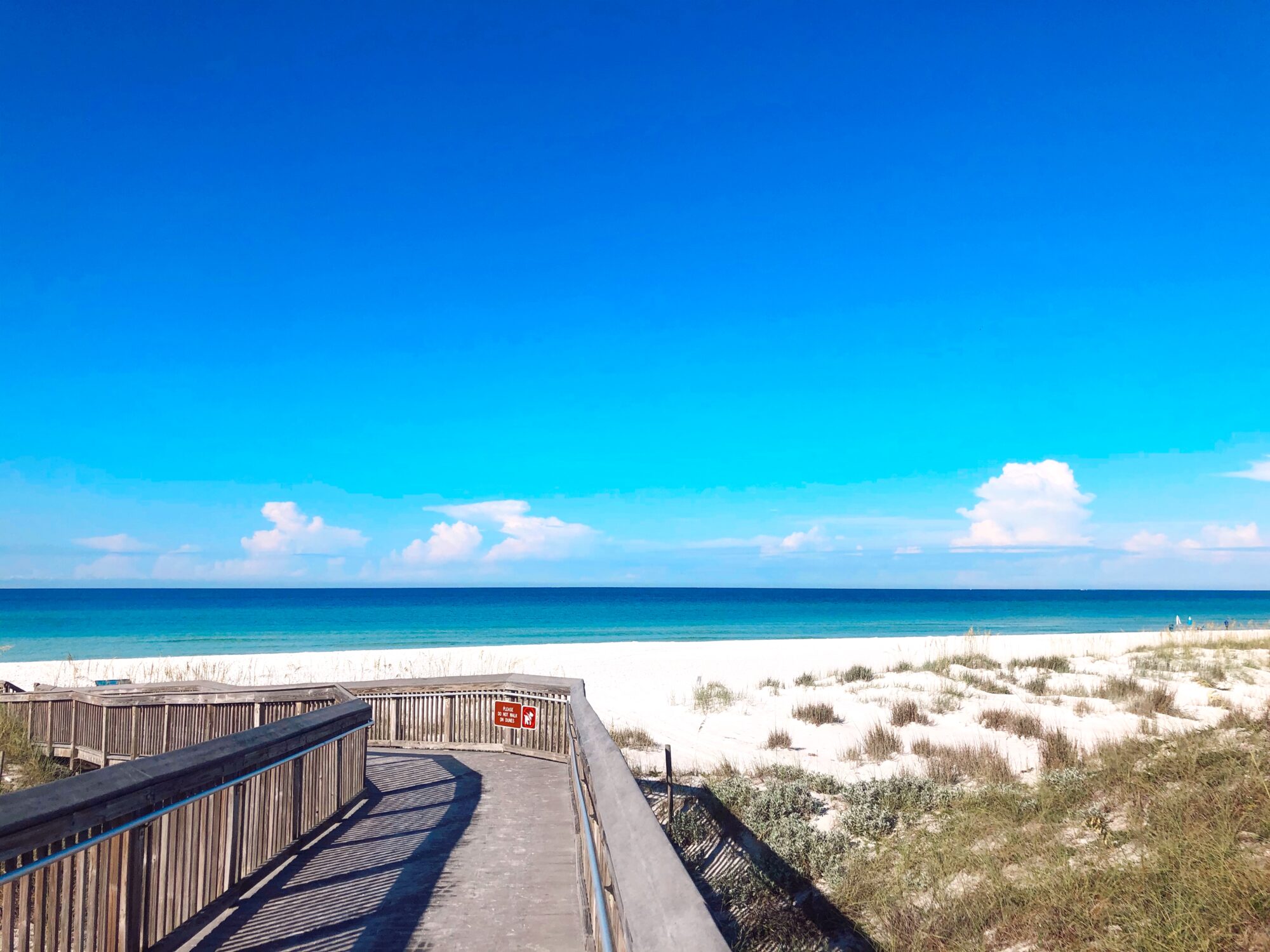 Camping site with beach view and a boardwalk 