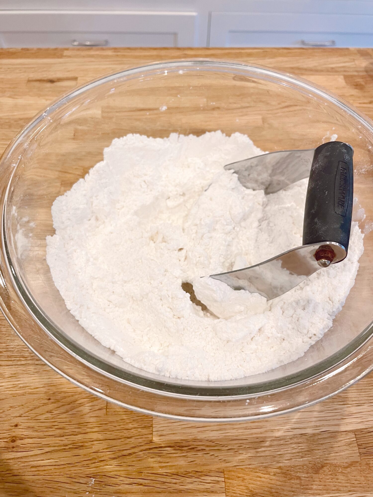 Flour and sifter in bowl