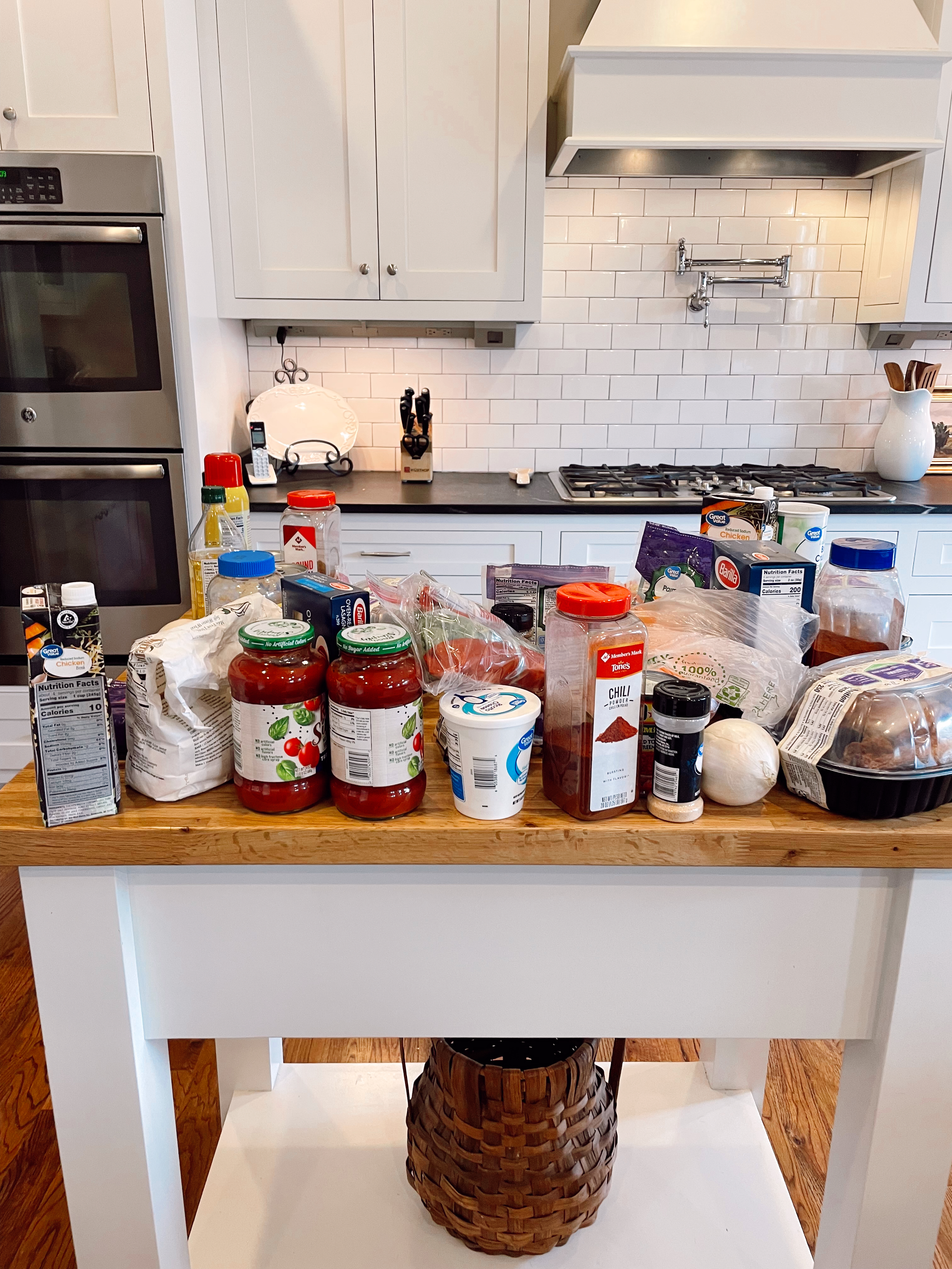 Various ingredients for freezer meals on a counter top in a kitchen. 