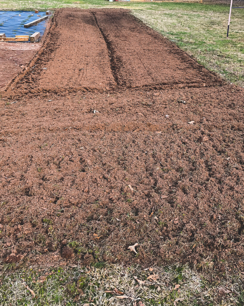 Uncovering the garden for spring planting. 