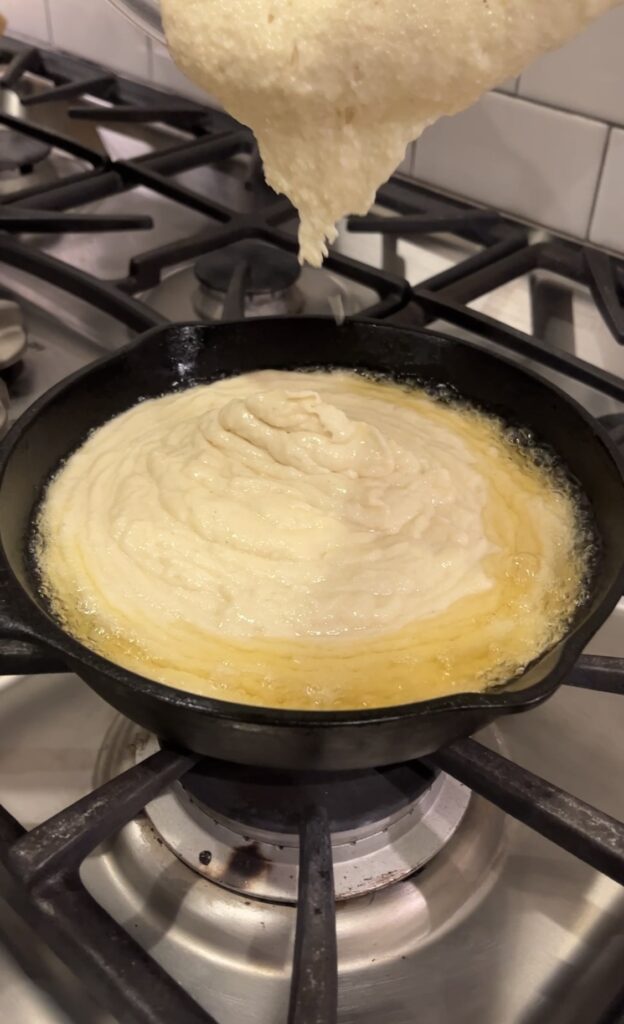 Southern Cornbread batter in a cast iron skillet 