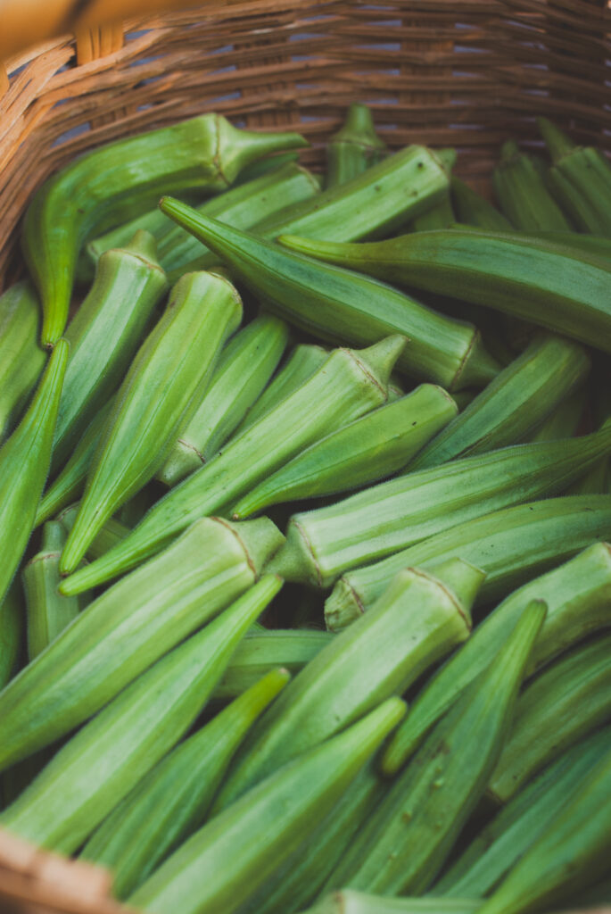 Okra pods in a woven basket 