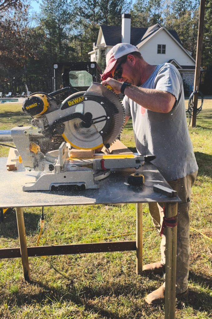 Man cutting wood for the using a table saw