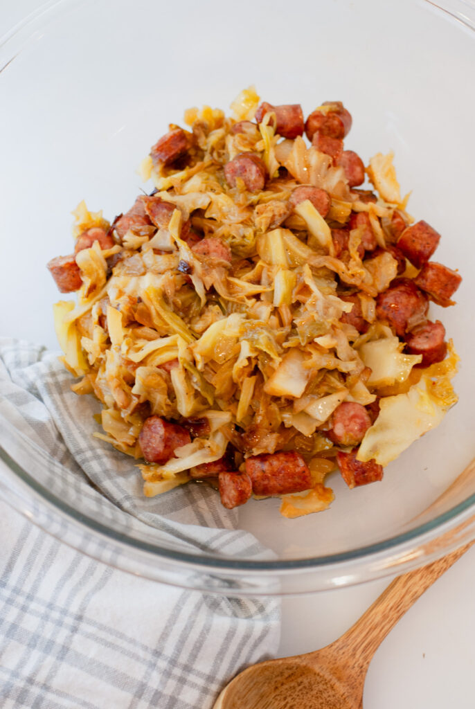 Cabbage and sausage in a glass bowl 