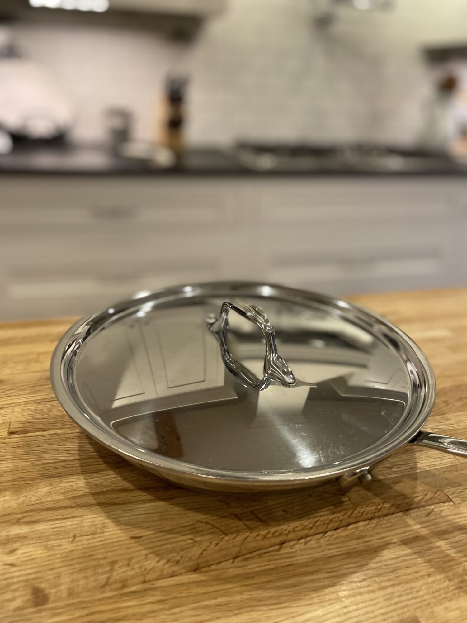 less toxic lifestyle stainless steel cookware on a wooden counter top. 