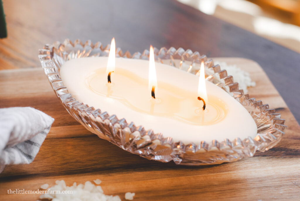 beeswax candle on wood table