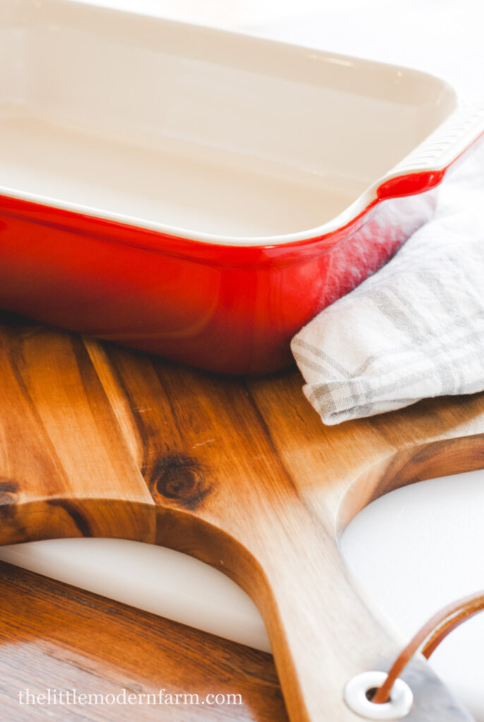 Stoneware casserole dish on a cutting board 