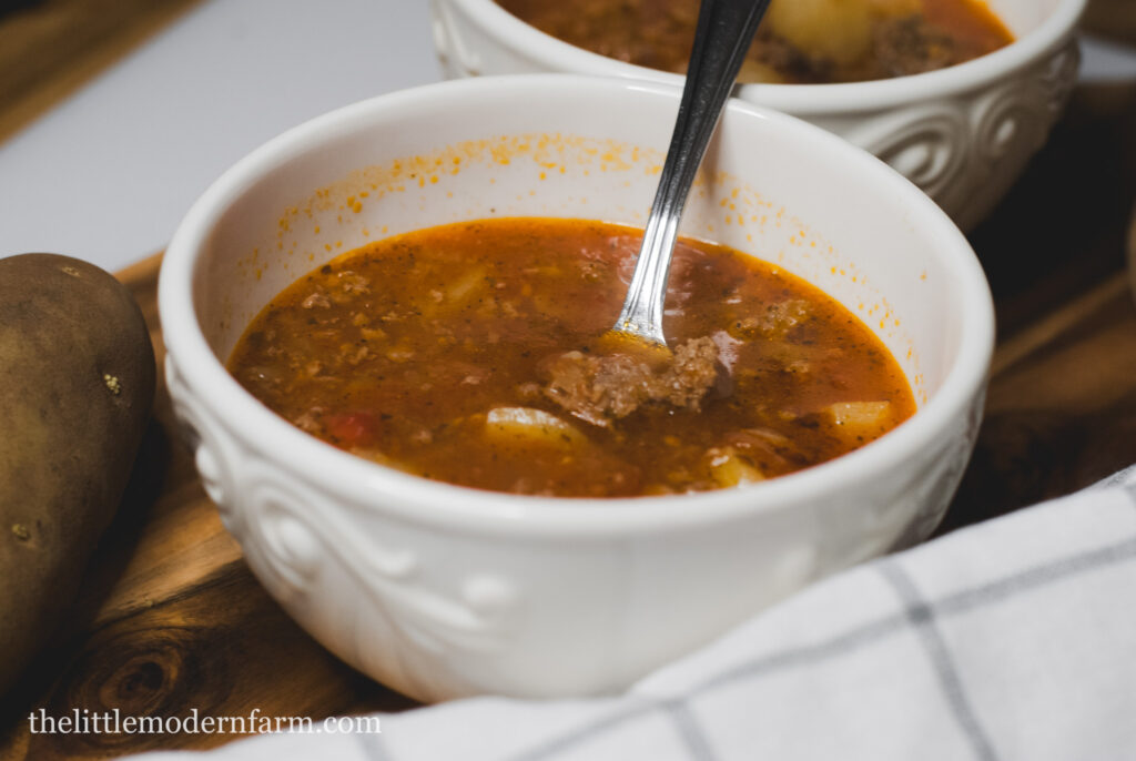 Soup with a spoon. 