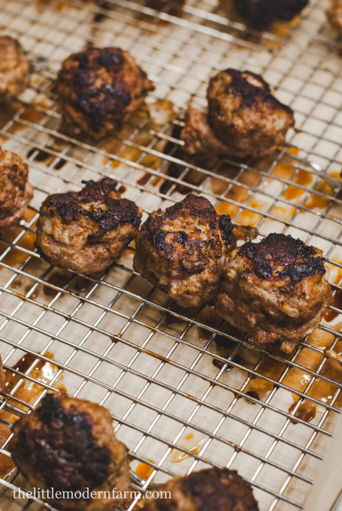 Meatballs on a  stainless steel rack