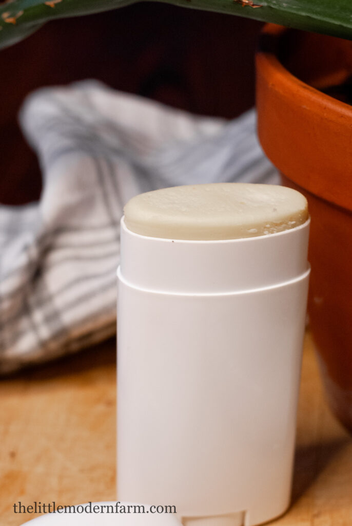 Deodorant in a white bottle on a counter top. -homemade magnesium deodorant 