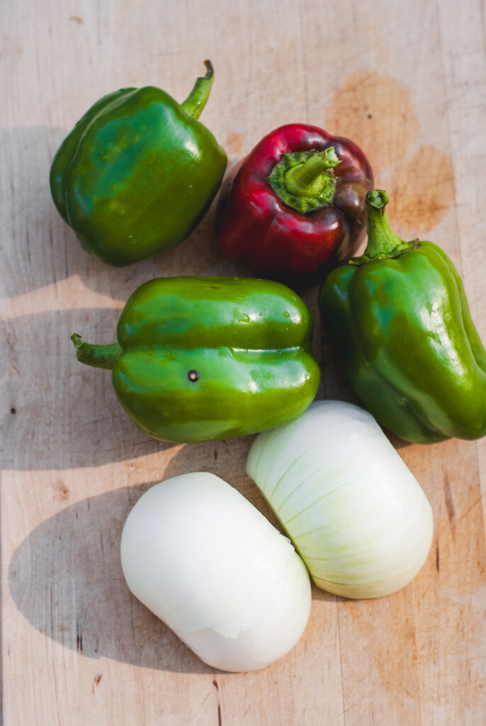 Bell pepper and onion on a cutting board 