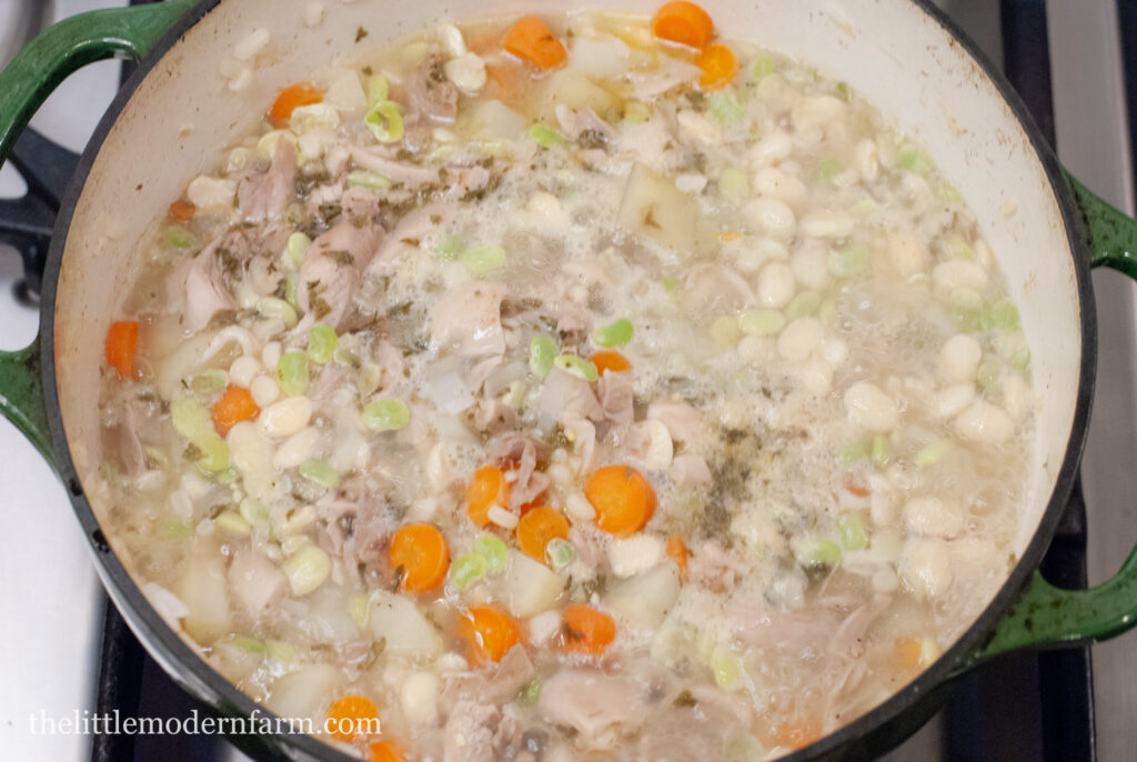 Vegetables in a large pot boiling 