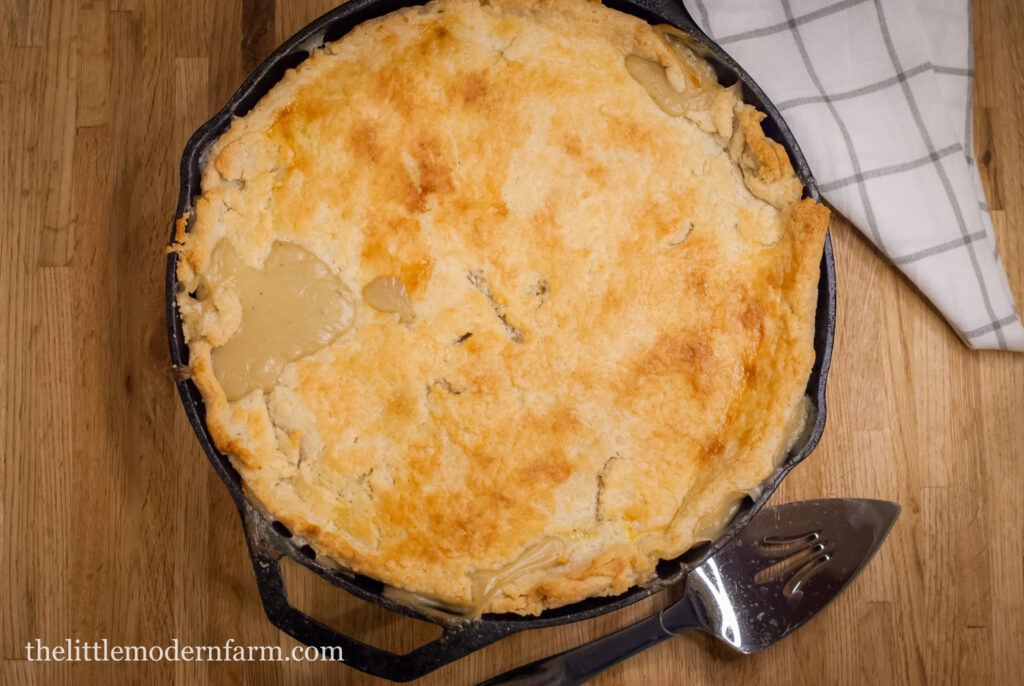 Chicken Pot Pie in a cast iron skillet on a counter top. 