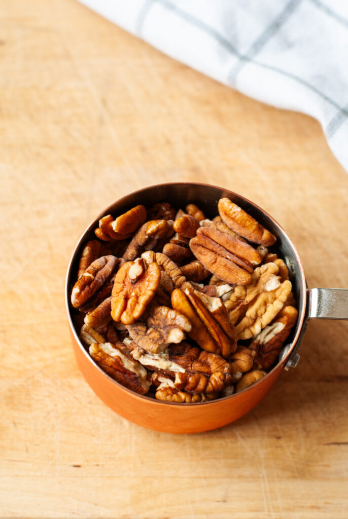 Measuring cup of pecans 