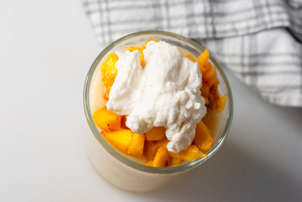 peaches and cream topped with whipped topping 