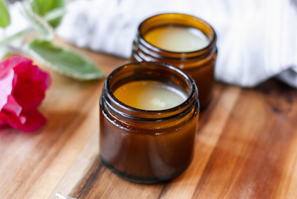 Amber jars on a wooden surface 