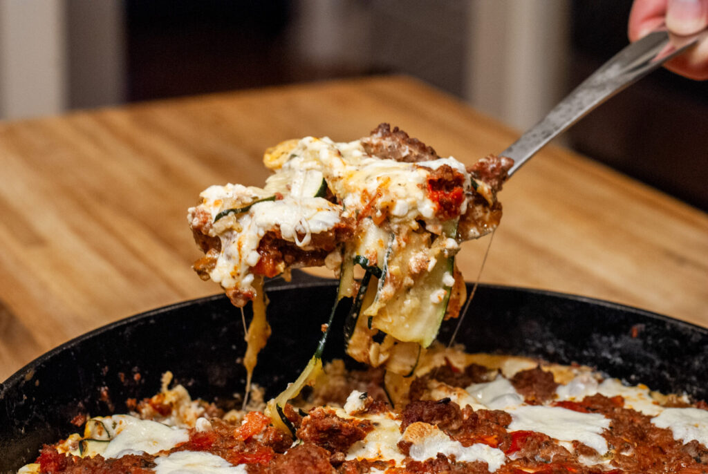 Lasagna with vegetables in a cast iron skillet 