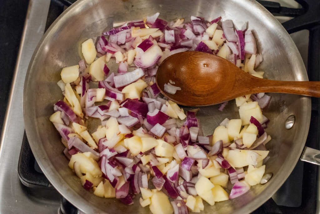 Apple and onions in a skillet. 