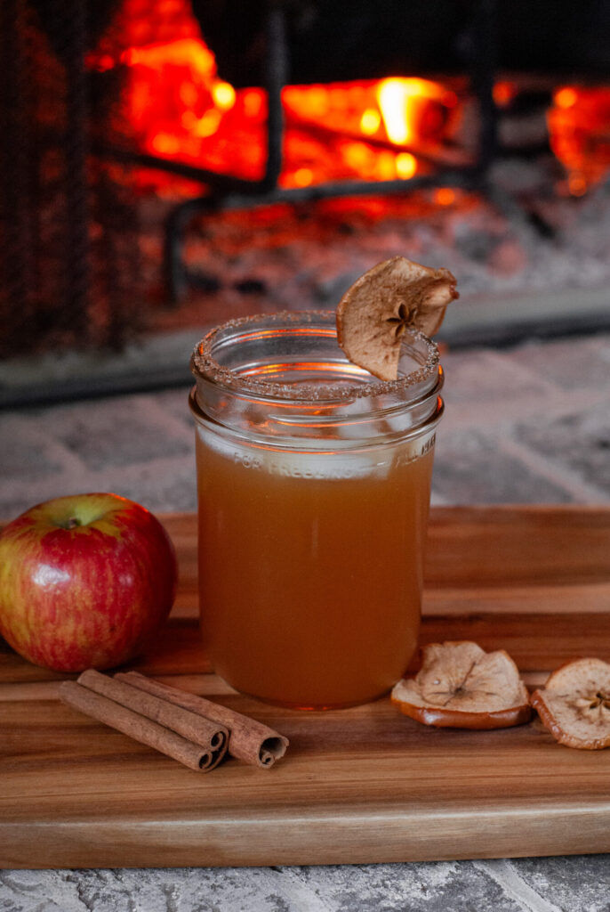 Cocktail on tray in front of fireplace