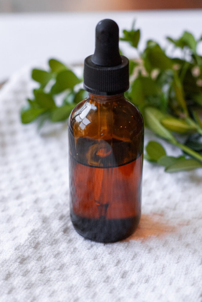 natural oil cleanser in an amber dropper bottle. 