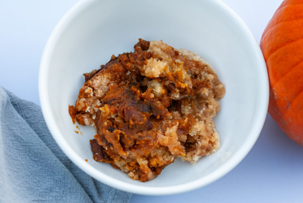 Pumpkin cobbler recipe in a bowl.
