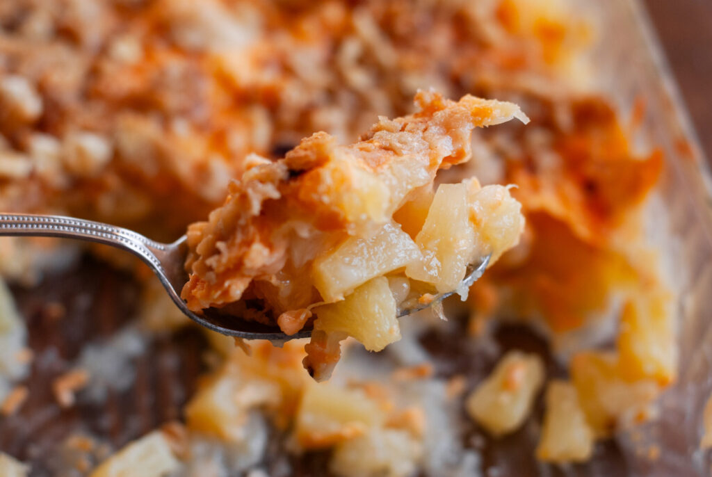 Pineapple Casserole on a spoon 