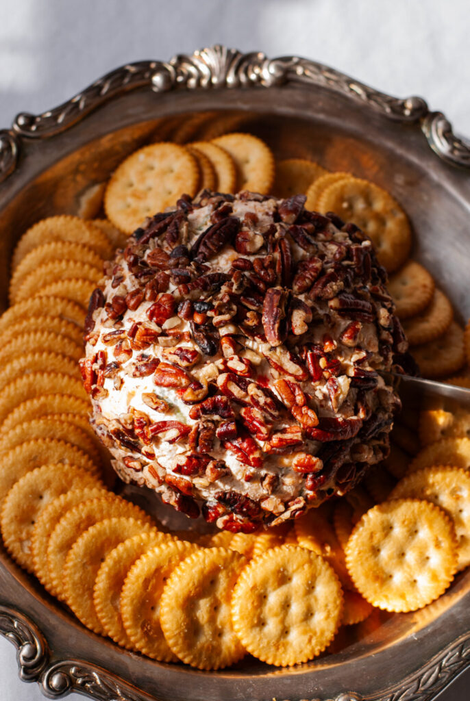 cheese dip with pecans and crackers 