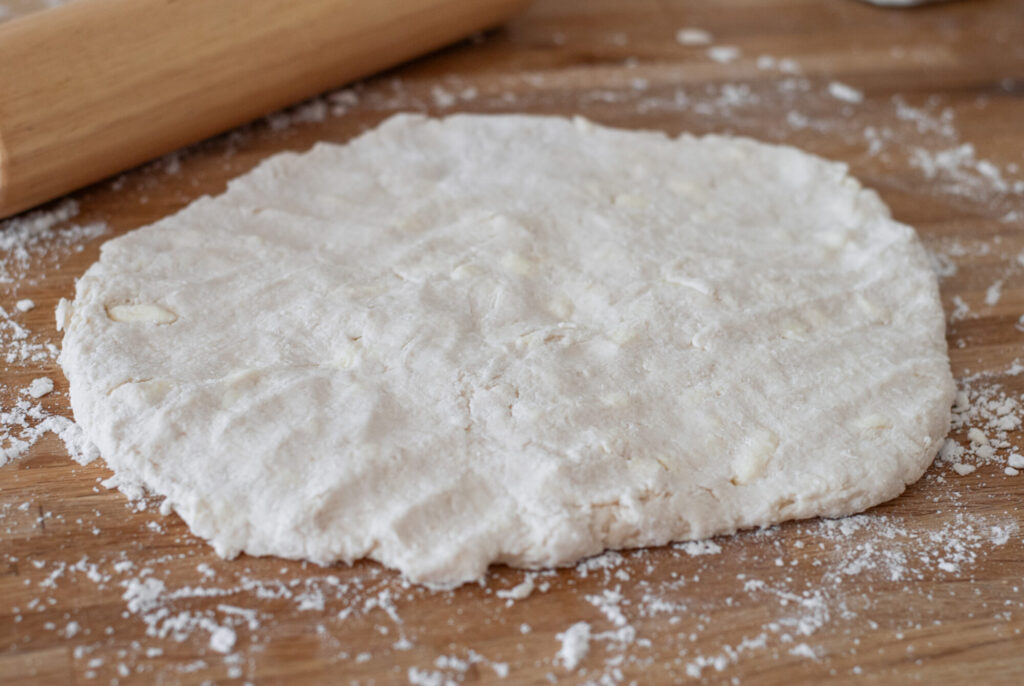 Biscuit dough on floured surface 