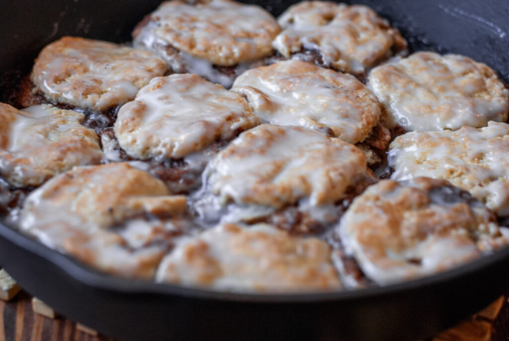 cinnamon roll biscuits in cast iron skillet 