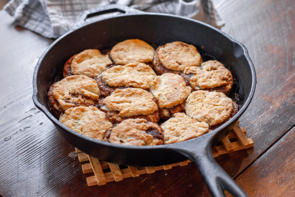 cinnamon roll biscuits in cast iron skillet 