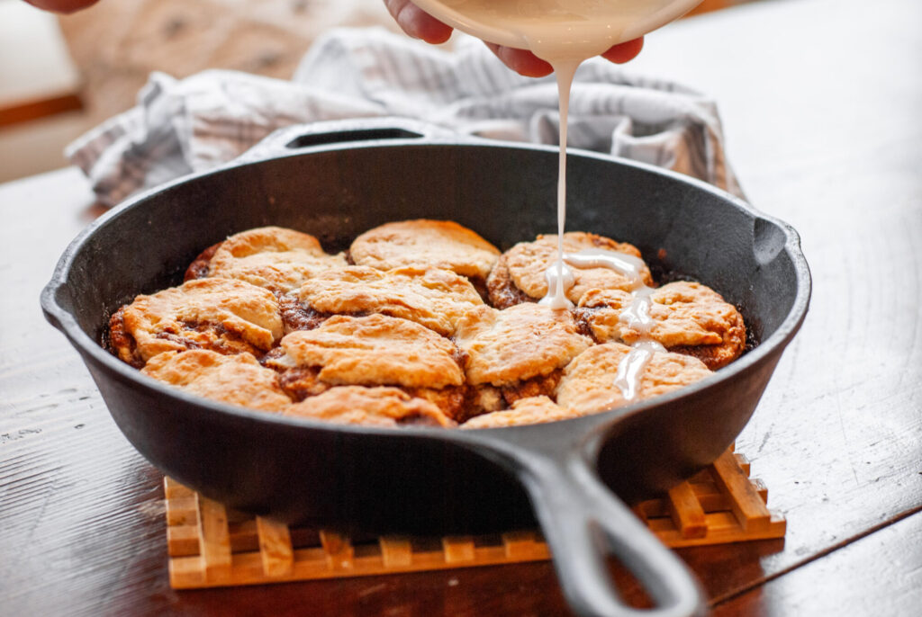 cinnamon roll biscuits with glaze on top 