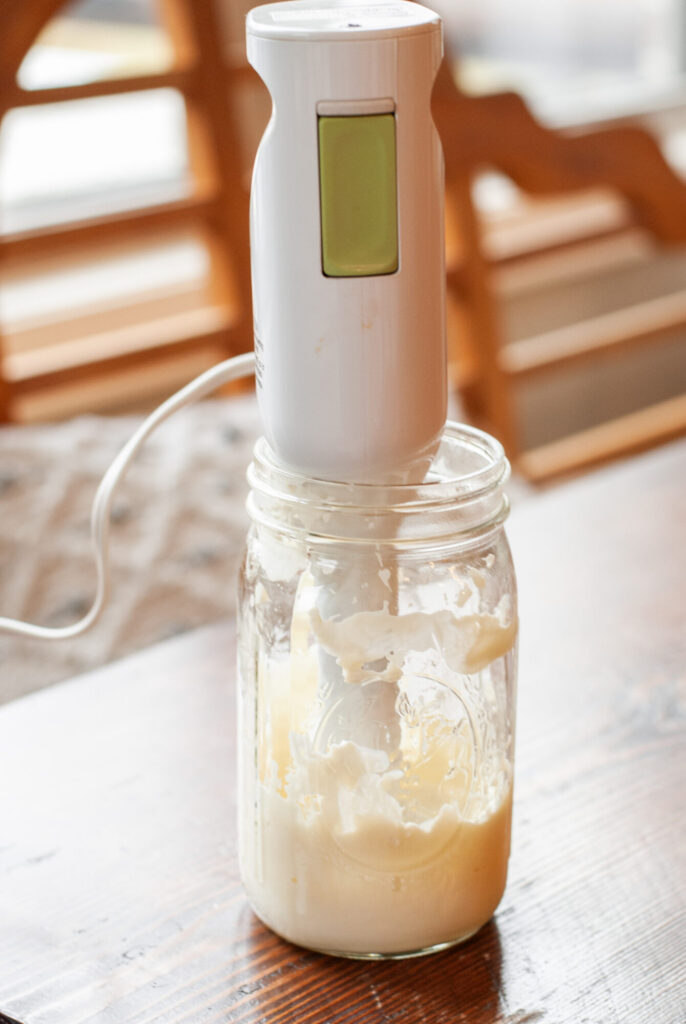 Immersion blender in glass canning jar with whipped lotion 