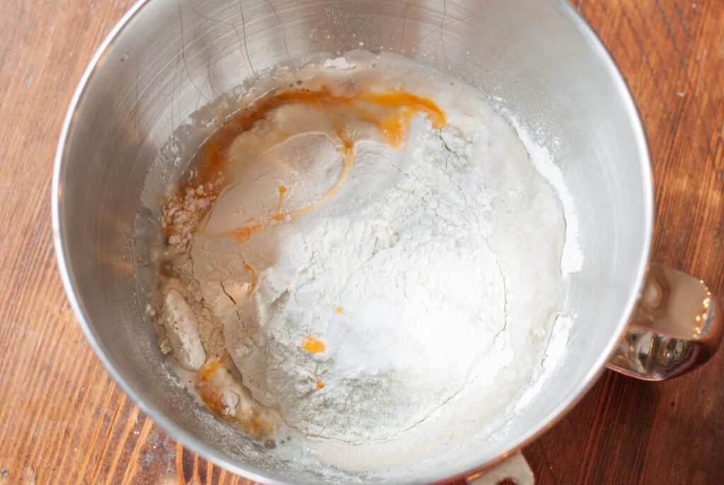 hamburger bun ingredients in a mixing bowl