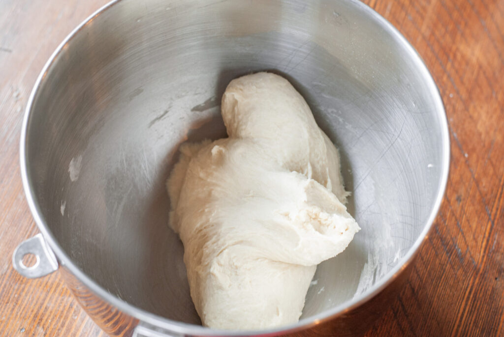 hamburger bun dough in a mixing bowl.