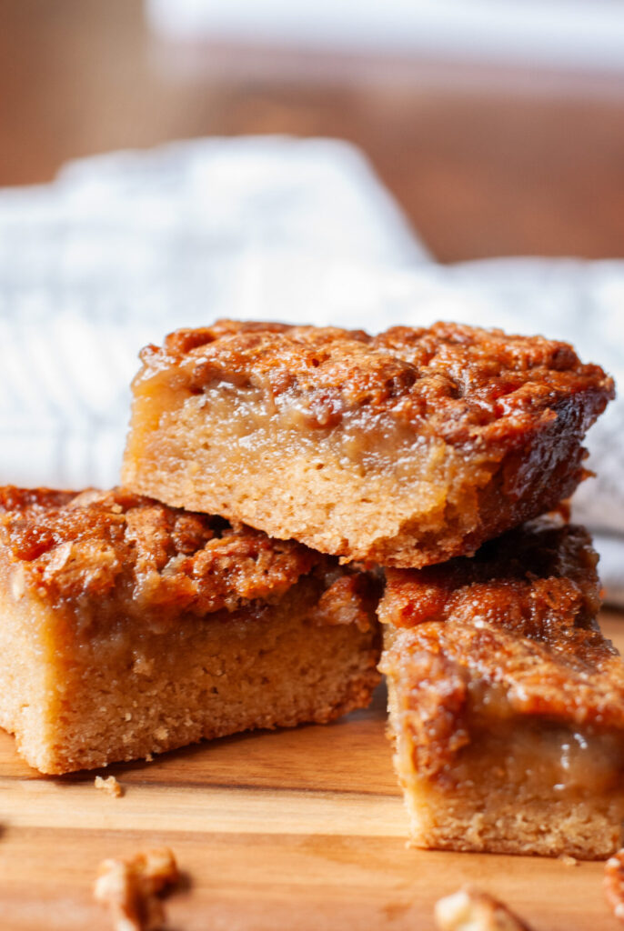 pecan pie blondies squares stacked on a board